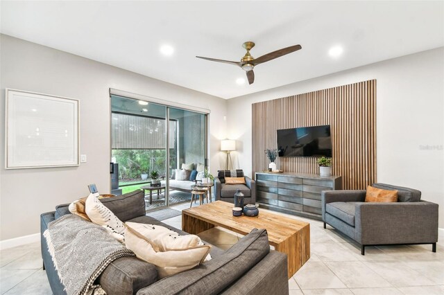 tiled living room featuring ceiling fan