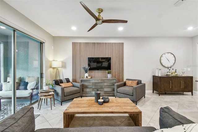 living room with ceiling fan and light tile patterned flooring