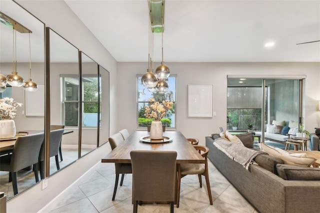 dining space featuring light tile patterned floors