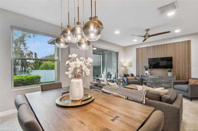 dining room featuring ceiling fan and light tile patterned flooring