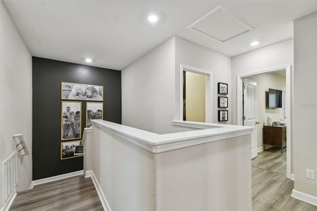 10012 Corso Milano Dr, Tampa, FL 33625 - hall featuring baseboards, recessed lighting, wood finished floors, and an upstairs landing