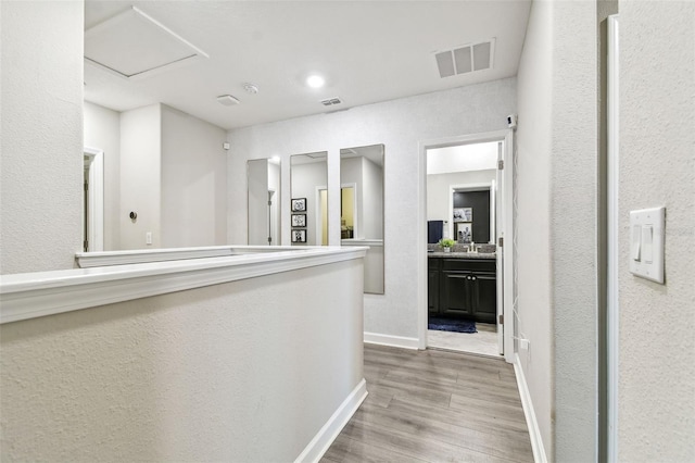 corridor featuring hardwood / wood-style floors