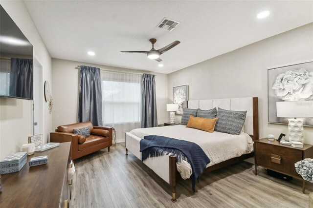 bedroom featuring ceiling fan and hardwood / wood-style floors