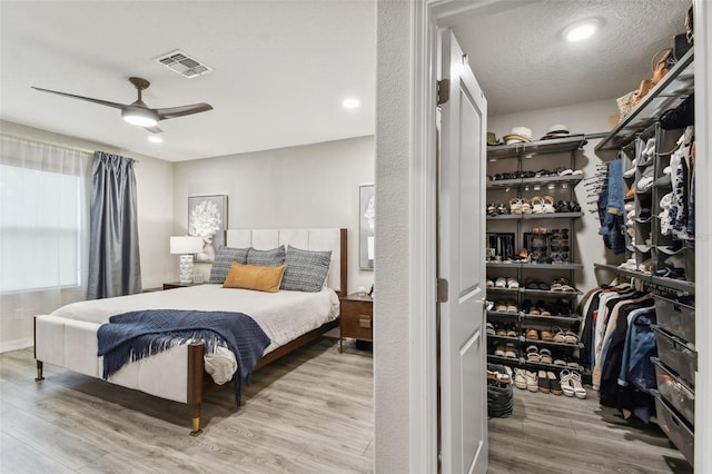 10012 Corso Milano Dr, Tampa, FL 33625 - bedroom with visible vents, ceiling fan, and wood finished floors