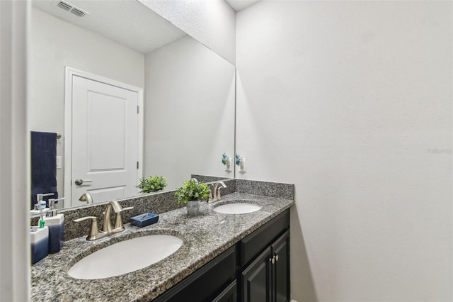 10012 Corso Milano Dr, Tampa, FL 33625 - bathroom featuring double vanity, visible vents, and a sink