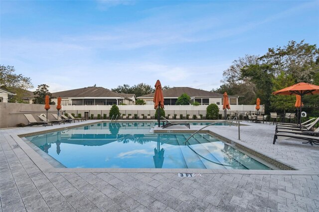 view of swimming pool featuring a patio