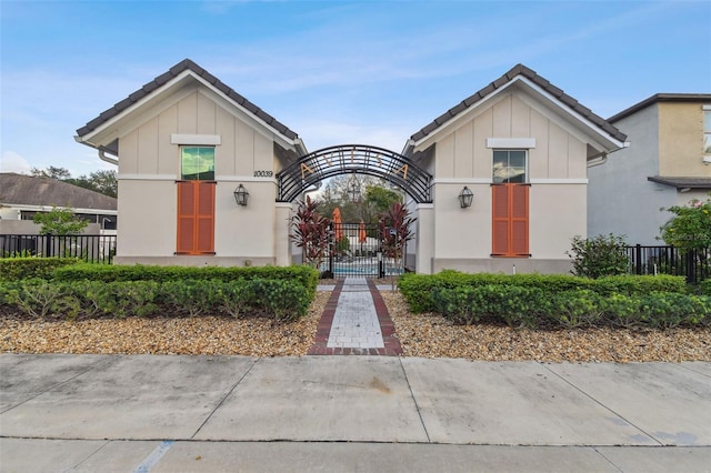 10012 Corso Milano Dr, Tampa, FL 33625 - view of front of property featuring board and batten siding and fence