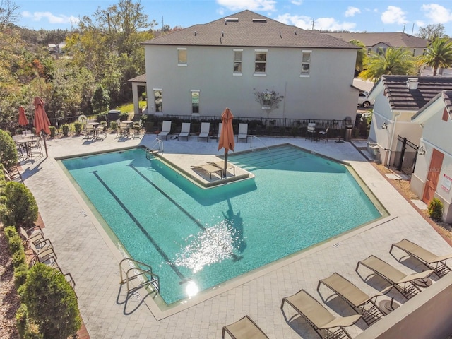 view of swimming pool with a patio