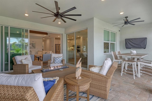 view of patio with ceiling fan and an outdoor hangout area