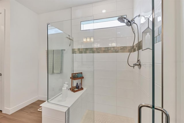 bathroom with a shower with shower door