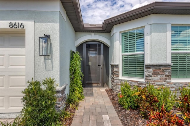 doorway to property featuring a garage