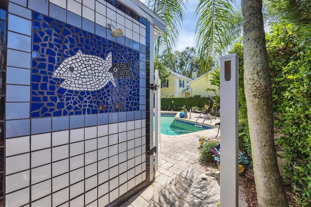 pool with a patio area