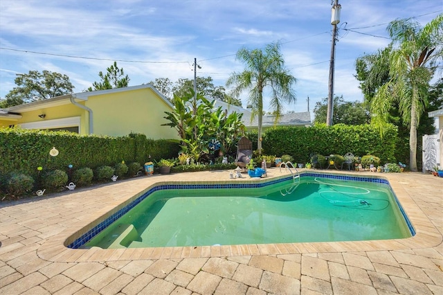 view of pool featuring a fenced in pool and a patio