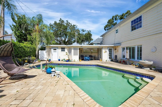 pool with a patio