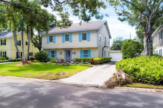 colonial house with brick siding and a front lawn