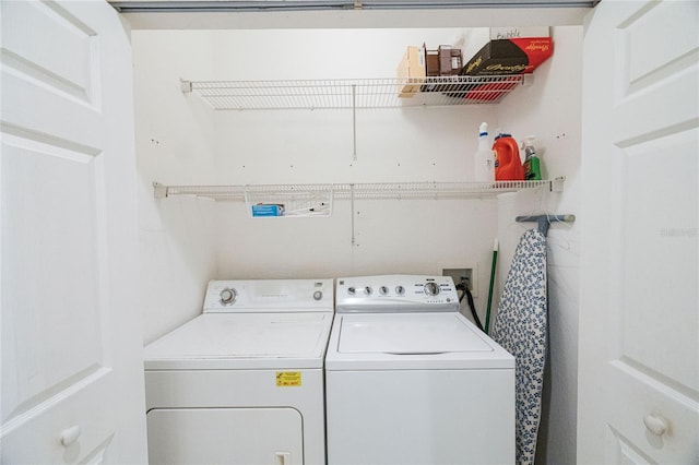 laundry area with washing machine and dryer