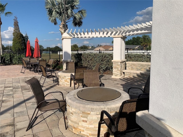 view of patio featuring an outdoor fire pit