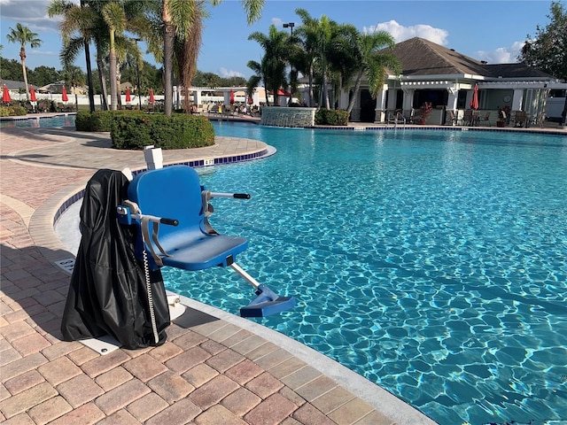 view of swimming pool with a patio