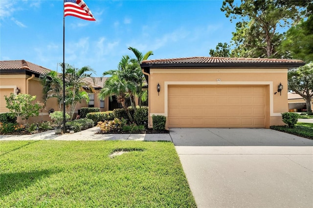 mediterranean / spanish home featuring stucco siding, a tiled roof, concrete driveway, and a front yard