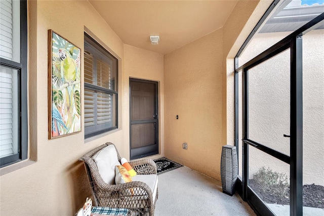 doorway to property with stucco siding