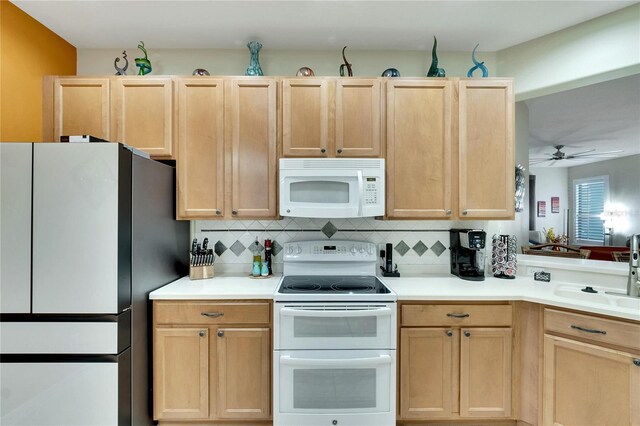 kitchen featuring ceiling fan, sink, light brown cabinets, white appliances, and decorative backsplash