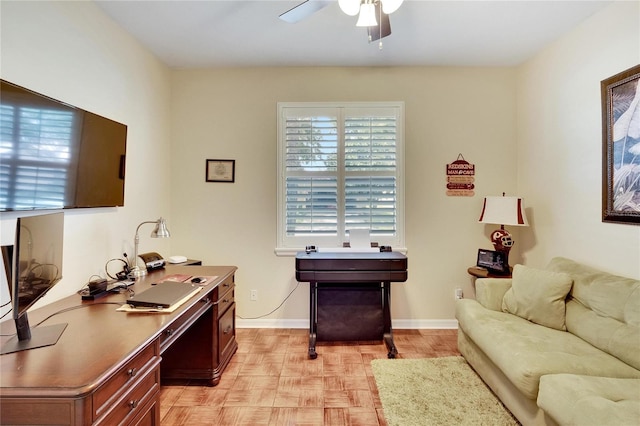 office space with ceiling fan and light parquet floors