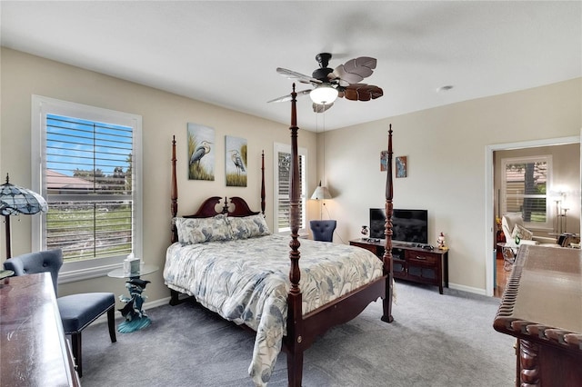 carpeted bedroom featuring baseboards and a ceiling fan