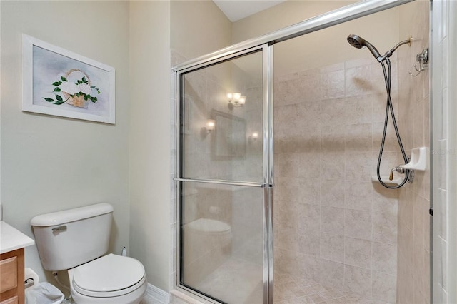 full bath featuring a shower stall, toilet, and vanity