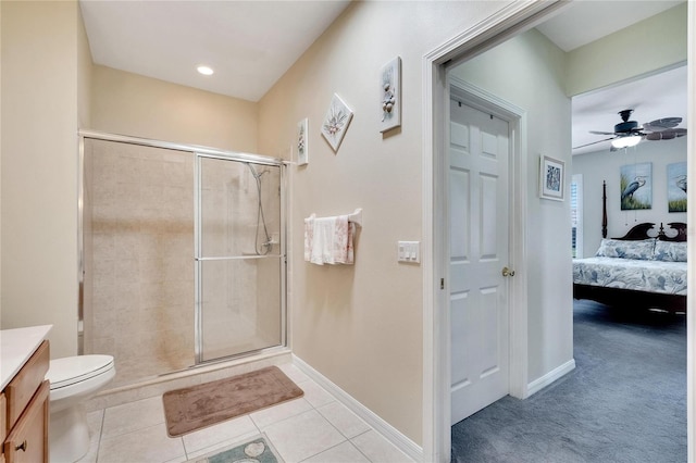 bathroom with baseboards, a shower stall, tile patterned floors, ensuite bath, and a ceiling fan