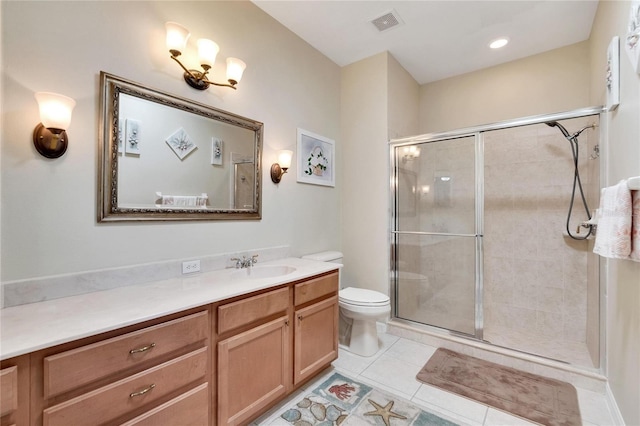 full bath featuring vanity, toilet, tile patterned flooring, and tiled shower