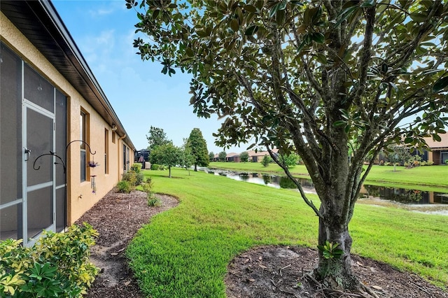 view of yard with a water view