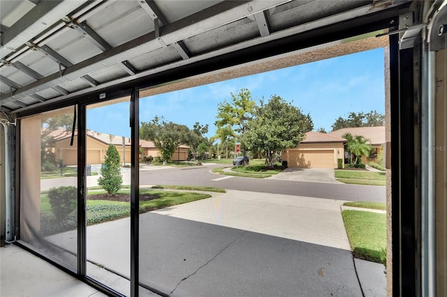 doorway to outside with a residential view