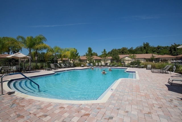 view of swimming pool featuring a patio area