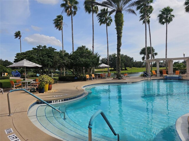 view of pool featuring a patio