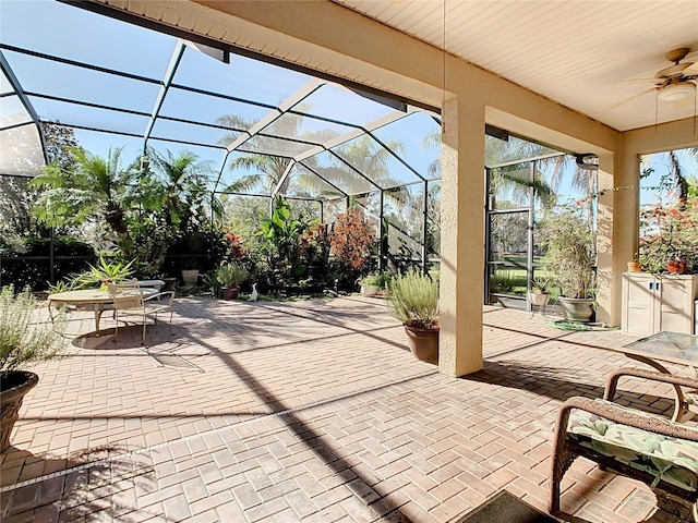 view of patio / terrace with a lanai and ceiling fan