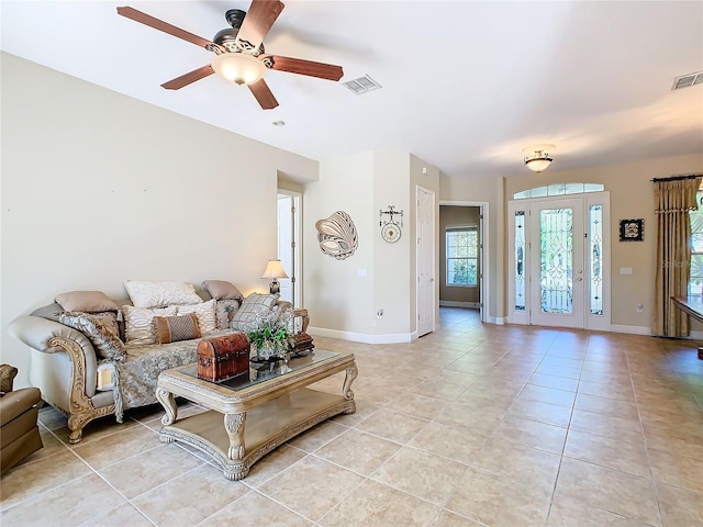 tiled living room featuring ceiling fan