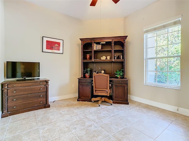 tiled office space with ceiling fan