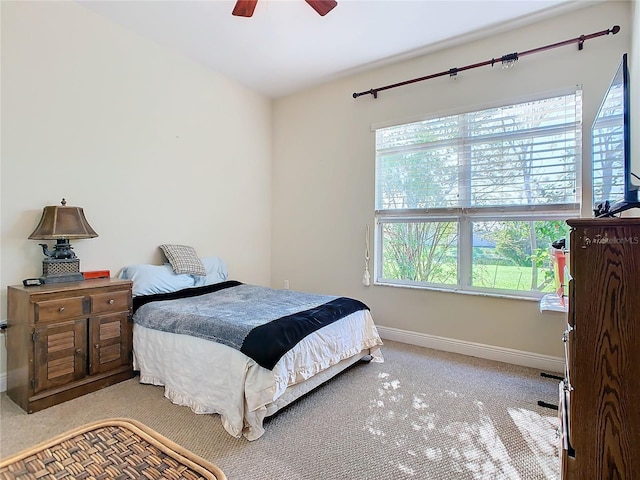 bedroom featuring ceiling fan and light colored carpet