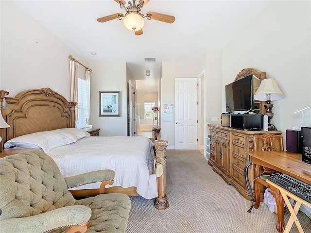 bedroom featuring light colored carpet and ceiling fan