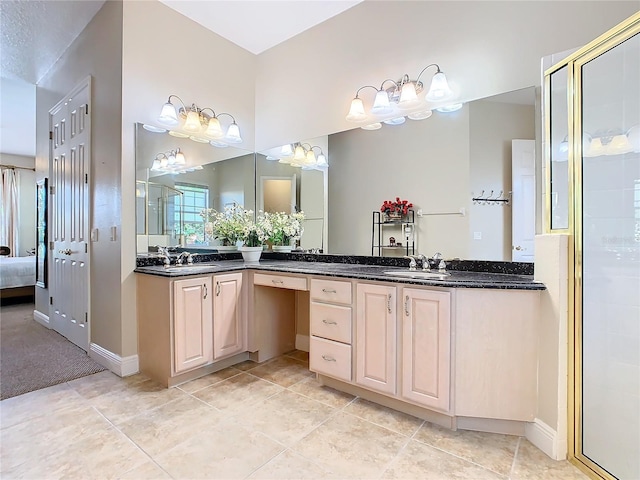 bathroom with tile patterned floors, vanity, and walk in shower