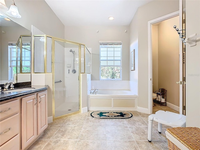 bathroom featuring tile patterned flooring, vanity, and shower with separate bathtub