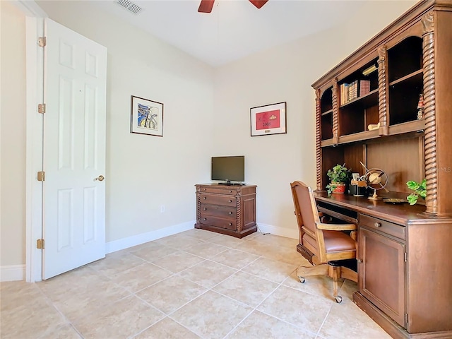 tiled home office featuring ceiling fan