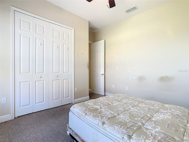 carpeted bedroom with a closet and ceiling fan