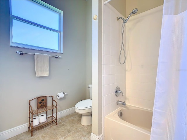 bathroom with shower / tub combo and toilet