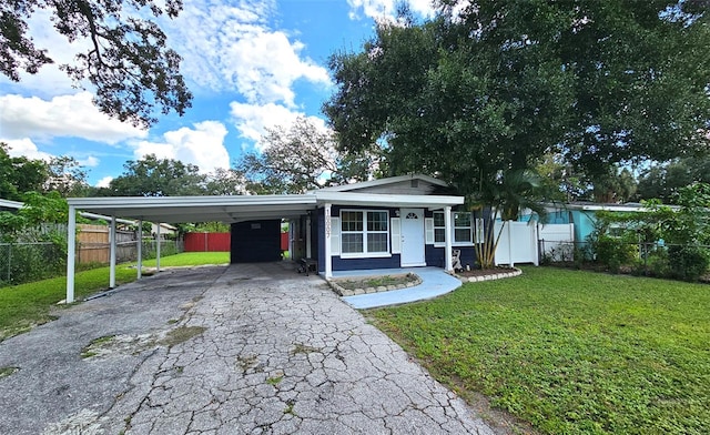 ranch-style home with a front lawn and a carport