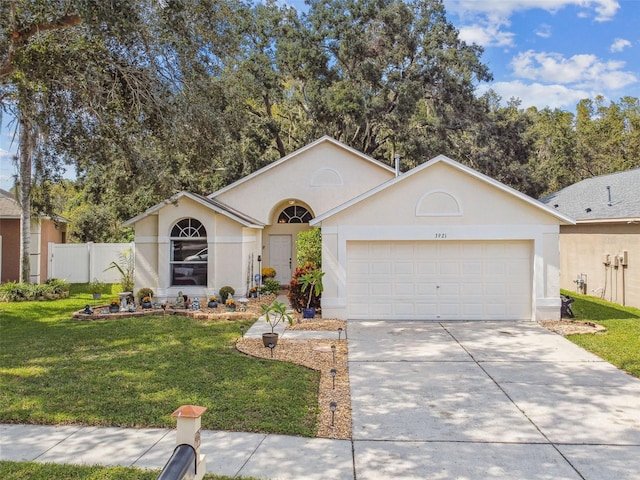 single story home featuring a front lawn and a garage