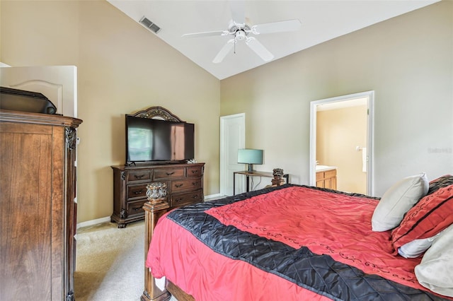 carpeted bedroom featuring ceiling fan, ensuite bath, and vaulted ceiling