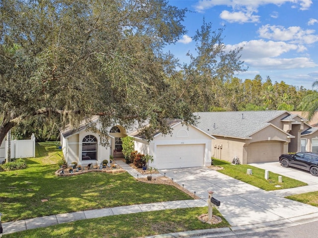 view of front facade featuring a front lawn and a garage