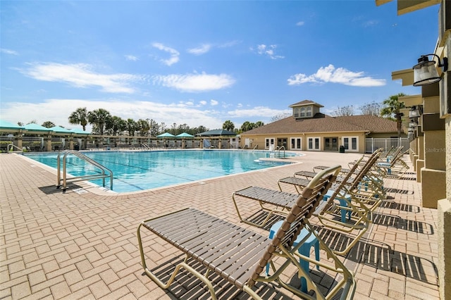 view of swimming pool featuring a patio area