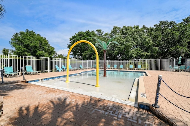 view of swimming pool with a patio area